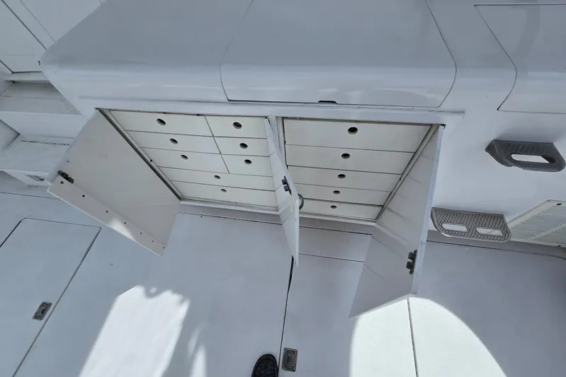  Yacht Photos Pics Open storage compartments on 1988 Topaz 44 Flybridge boat deck.
