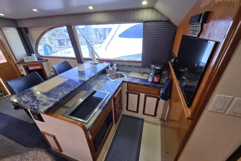  Yacht Photos Pics Interior of 1988 Topaz 44 Flybridge yacht with modern kitchen and seating area.