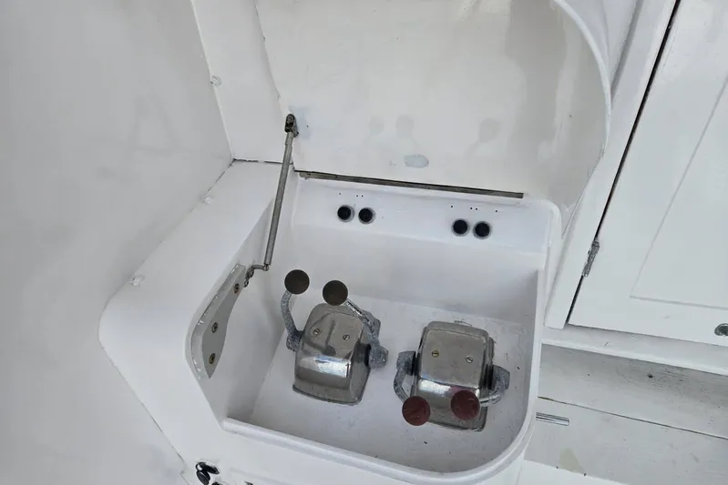  Yacht Photos Pics Control panel of a 1988 Topaz 44 Flybridge boat with dual levers.