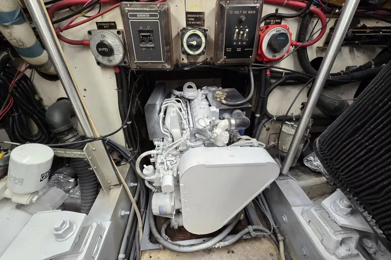  Yacht Photos Pics Engine room of 1988 Topaz 44 Flybridge with generator and wiring components.