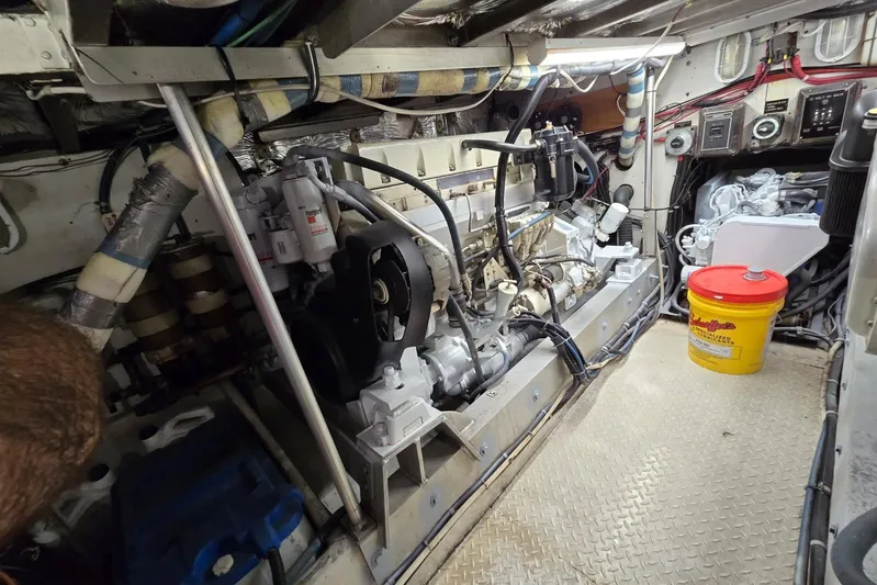  Yacht Photos Pics Engine room of a 1988 Topaz 44 Flybridge boat, featuring mechanical components and equipment.