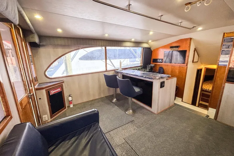  Yacht Photos Pics Interior of 1988 Topaz 44 Flybridge yacht with modern seating and entertainment area.