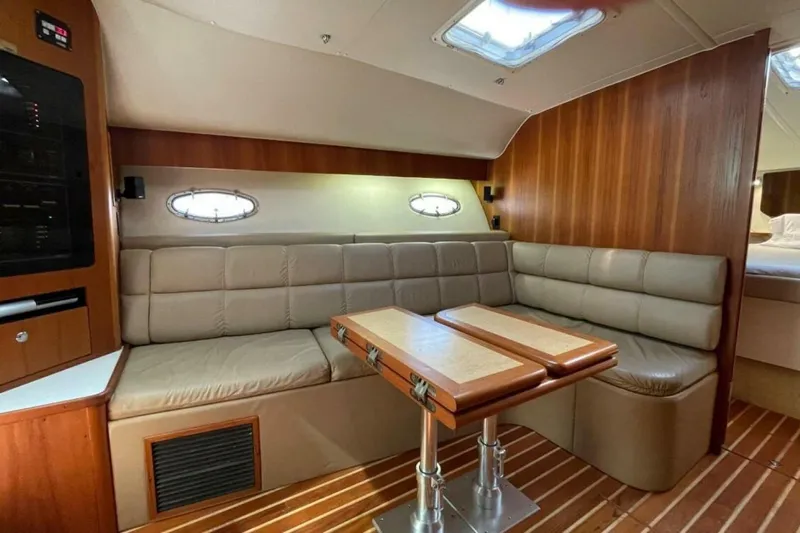 Bluefin Yacht Photos Pics Interior of 2000 Tiara 41 Open yacht with leather seating and wooden accents.
