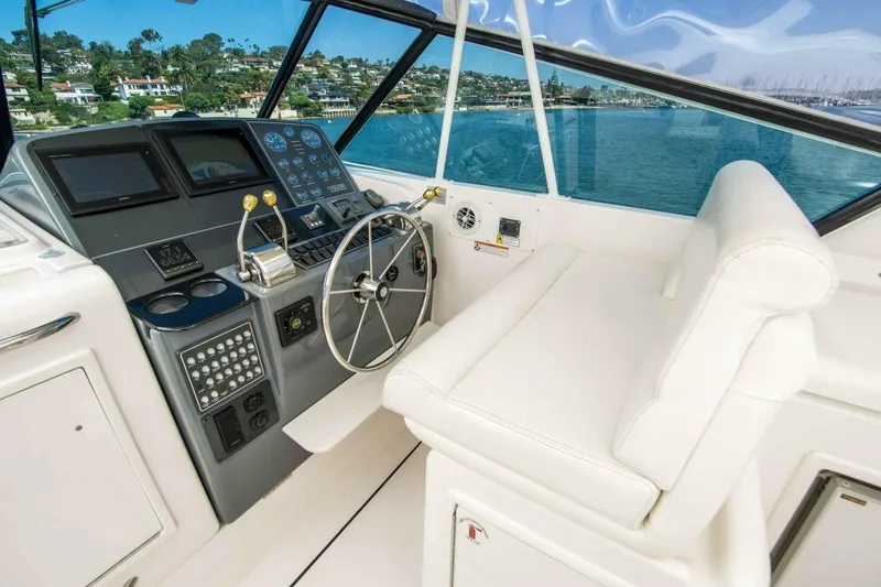Bluefin Yacht Photos Pics Helm of 2000 Tiara 41 Open yacht with modern controls and scenic ocean view.