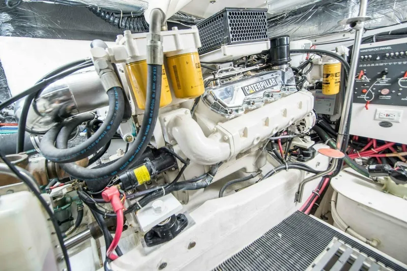 Bluefin Yacht Photos Pics Engine room of a 2000 Tiara 41 Open yacht featuring a Caterpillar engine.