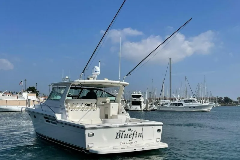 Bluefin Yacht Photos Pics 2000 Tiara 41 Open yacht "Bluefin" in marina, San Diego, clear sky.
