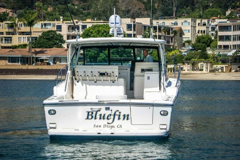 Bluefin Yacht Photos Pics 2000 Tiara 41 Open yacht "Bluefin" in San Diego waters, with coastal homes in background.