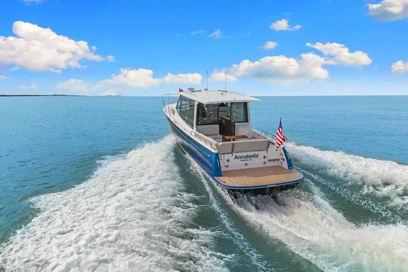 Mjm 42 For Sale Yacht Photos Pics 2024 MJM 42 yacht cruising on open water under a clear blue sky.