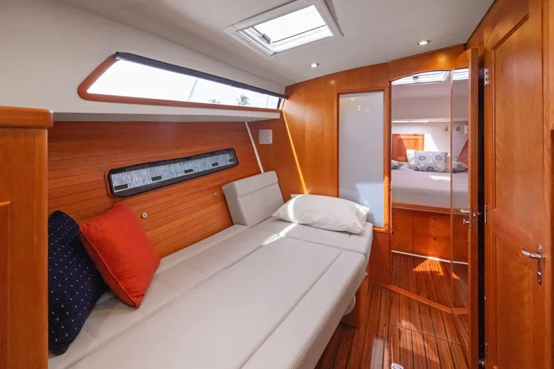 Mjm 42 For Sale Yacht Photos Pics Luxurious interior of 2024 MJM 42 yacht with cozy seating and elegant wood finish.