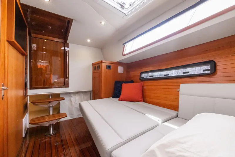 Mjm 42 For Sale Yacht Photos Pics Luxurious interior of 2024 MJM 42 yacht with wooden paneling and modern furnishings.
