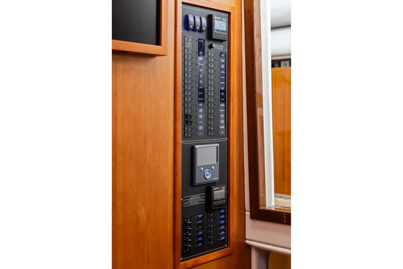 Mjm 42 For Sale Yacht Photos Pics Electrical control panel on 2024 MJM 42 yacht, featuring switches and digital display.