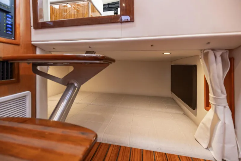 Mjm 42 For Sale Yacht Photos Pics 2024 MJM 42 interior cabin with wooden steps and cozy sleeping area.