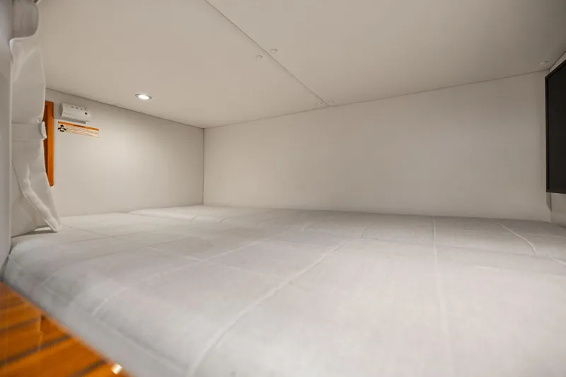 Mjm 42 For Sale Yacht Photos Pics 2024 MJM 42 yacht interior cabin with cozy white bedding.