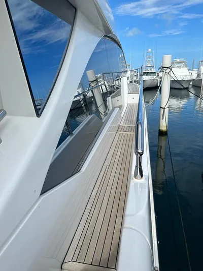  Yacht Photos Pics 2019 Azimut 60 Flybridge yacht docked at a marina.