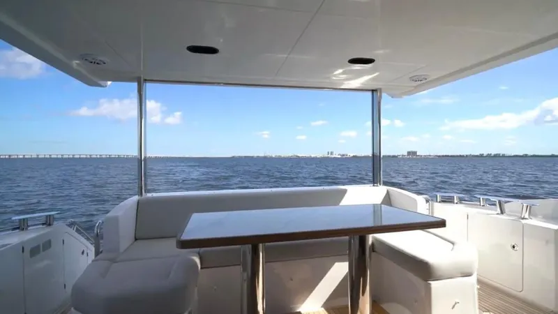  Yacht Photos Pics 2019 Azimut 60 Flybridge yacht with ocean view from the flybridge seating area.