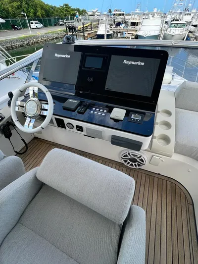  Yacht Photos Pics 2019 Azimut 60 Flybridge yacht helm with Raymarine navigation system.