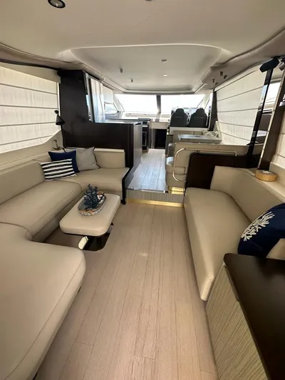  Yacht Photos Pics Luxurious interior of 2019 Azimut 60 Flybridge yacht with modern seating and decor.