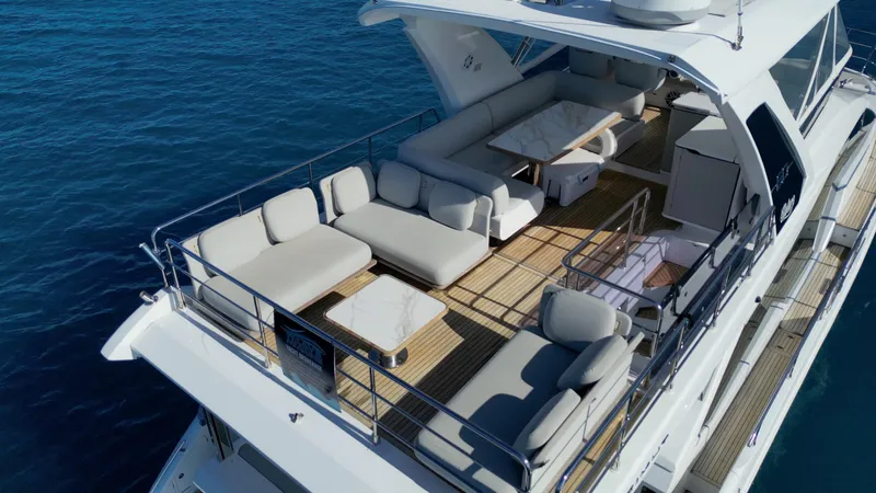  Yacht Photos Pics 2019 Azimut 60 Flybridge yacht with spacious upper deck and luxurious seating.