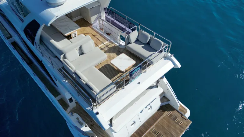  Yacht Photos Pics 2019 Azimut 60 Flybridge luxury yacht with spacious deck and seating area.