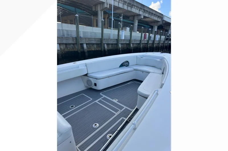  Yacht Photos Pics 2012 Contender 35 LS boat interior with cushioned seating and sleek flooring.