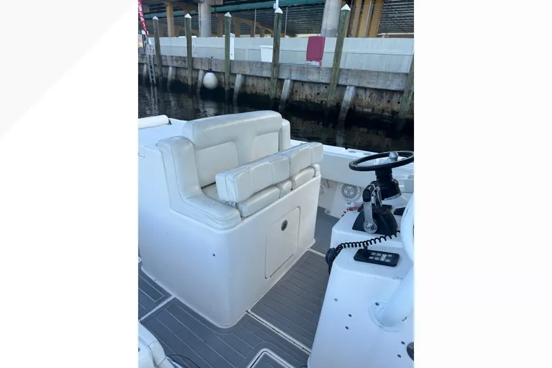  Yacht Photos Pics 2012 Contender 35 LS boat interior with white seating and steering console.