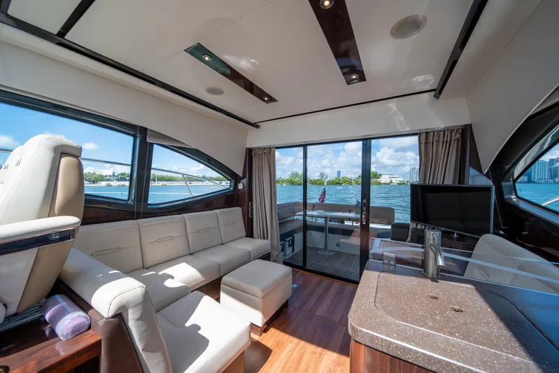 Yacht Photos Pics Luxurious interior of 2016 Sea Ray 400 Sundancer yacht with waterfront view.