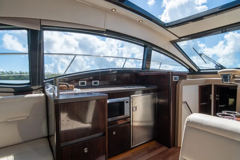  Yacht Photos Pics Luxurious interior of 2016 Sea Ray 400 Sundancer yacht with modern kitchen amenities.