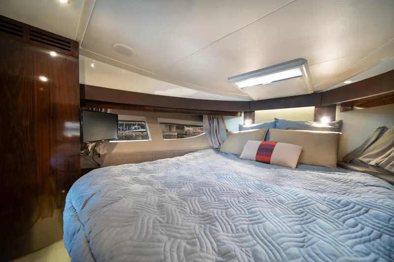  Yacht Photos Pics Luxurious cabin interior of 2016 Sea Ray 400 Sundancer yacht with cozy bedding.