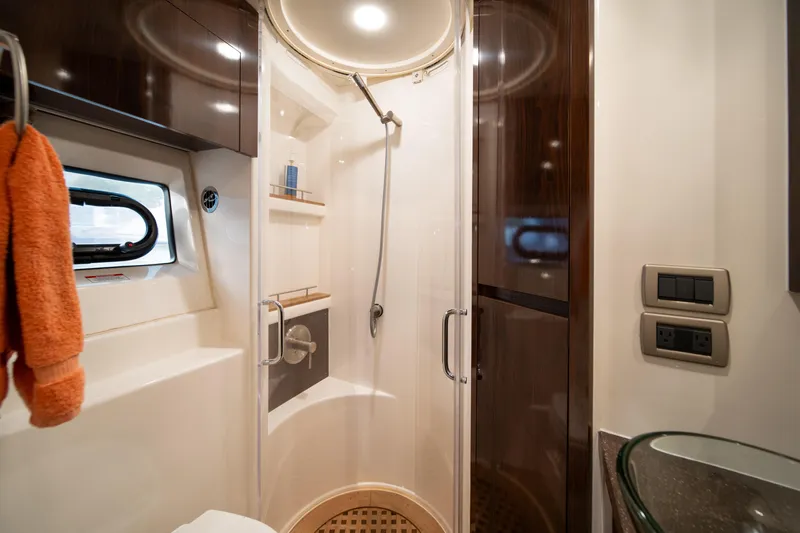  Yacht Photos Pics Luxurious bathroom in 2016 Sea Ray 400 Sundancer yacht with modern shower and amenities.