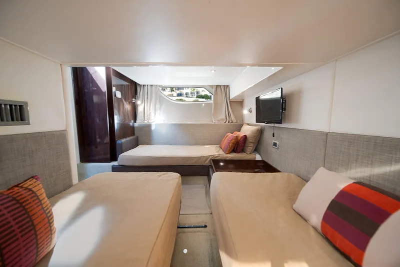  Yacht Photos Pics Luxurious interior cabin of 2016 Sea Ray 400 Sundancer yacht with twin beds and modern decor.