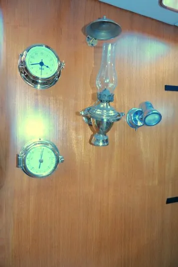 Peregrine Yacht Photos Pics Wall-mounted nautical instruments and lamp on Tayana 460 Vancouver Pilothouse, 2002 model.