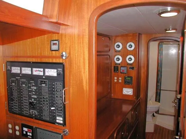Peregrine Yacht Photos Pics Interior of 2002 Tayana 460 Vancouver Pilothouse with control panels and wooden finish.