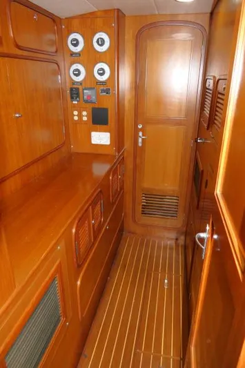 Peregrine Yacht Photos Pics 2002 Tayana 460 Vancouver Pilothouse interior with wood paneling and control gauges.