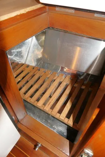 Peregrine Yacht Photos Pics Wooden storage compartment in 2002 Tayana 460 Vancouver Pilothouse yacht interior.