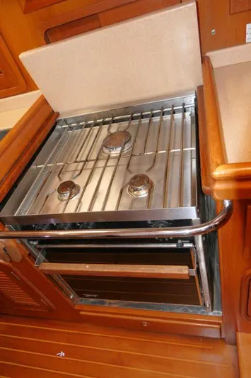 Peregrine Yacht Photos Pics Stainless steel stove in 2002 Tayana 460 Vancouver Pilothouse yacht kitchen.