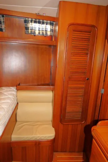 Peregrine Yacht Photos Pics 2002 Tayana 460 Vancouver Pilothouse interior with wooden cabinetry and seating.