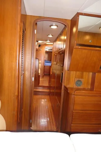 Peregrine Yacht Photos Pics Interior of 2002 Tayana 460 Vancouver Pilothouse with wooden finishes and cozy cabin layout.