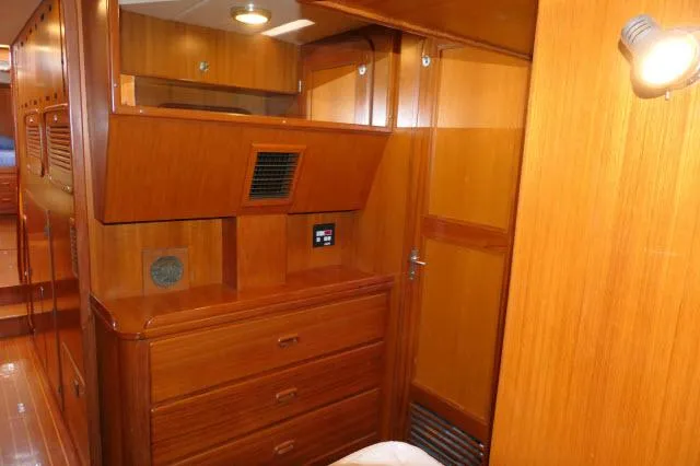 Peregrine Yacht Photos Pics Interior of 2002 Tayana 460 Vancouver Pilothouse with wooden cabinetry and ambient lighting.