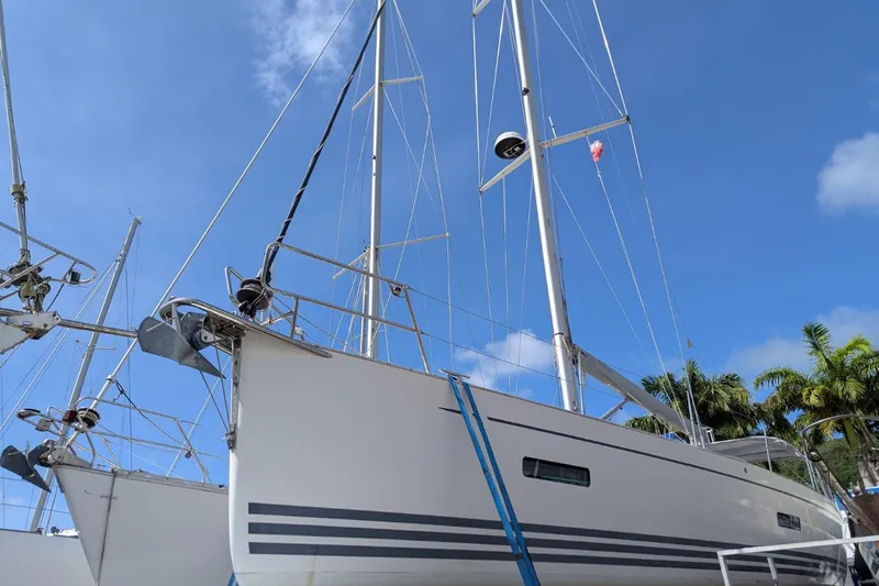 Muchacha De Abril Yacht Photos Pics 2017 X-Yachts Xc 45 sailboat with blue sky and palm trees in background.