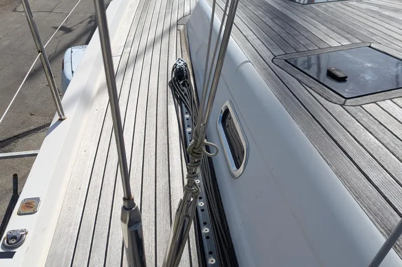 Muchacha De Abril Yacht Photos Pics Deck of 2017 X-Yachts Xc 45 sailboat with sleek wood finish and rigging details.