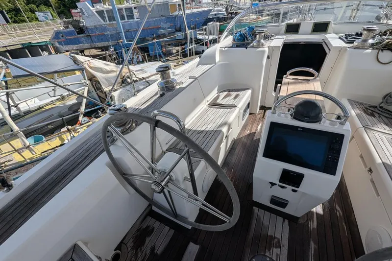 Muchacha De Abril Yacht Photos Pics 2017 X-Yachts Xc 45 sailboat cockpit with steering wheel and navigation equipment.