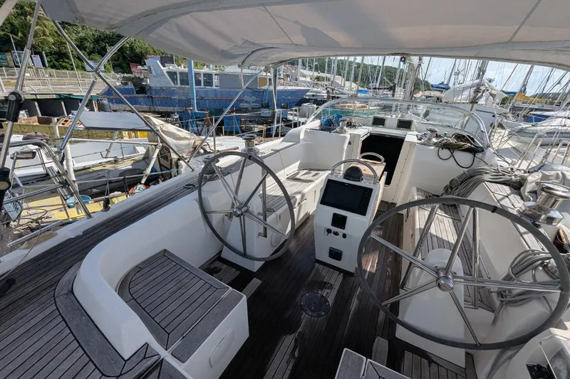 Muchacha De Abril Yacht Photos Pics 2017 X-Yachts Xc 45 sailboat cockpit with dual steering wheels and navigation equipment.