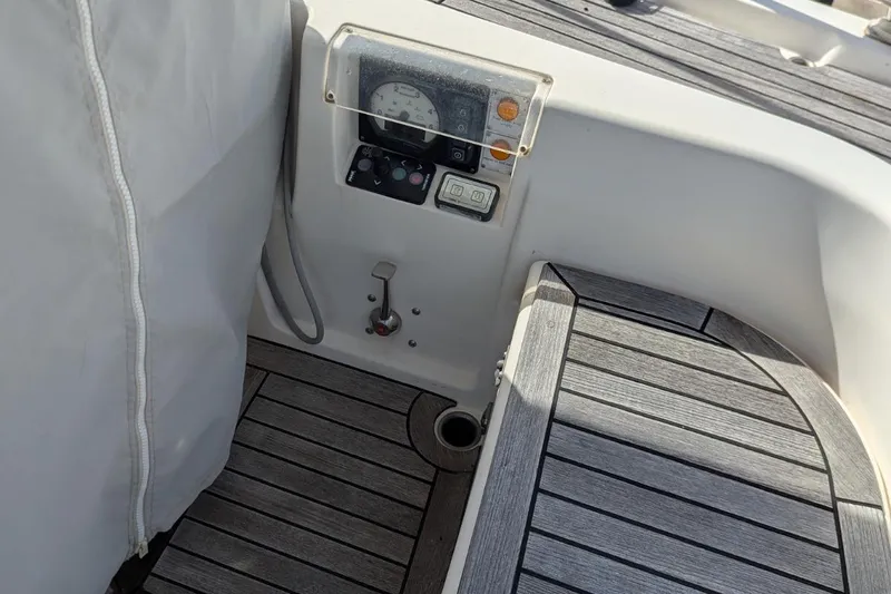 Muchacha De Abril Yacht Photos Pics Cockpit controls of 2017 X-Yachts Xc 45 with teak flooring and instrument panel.