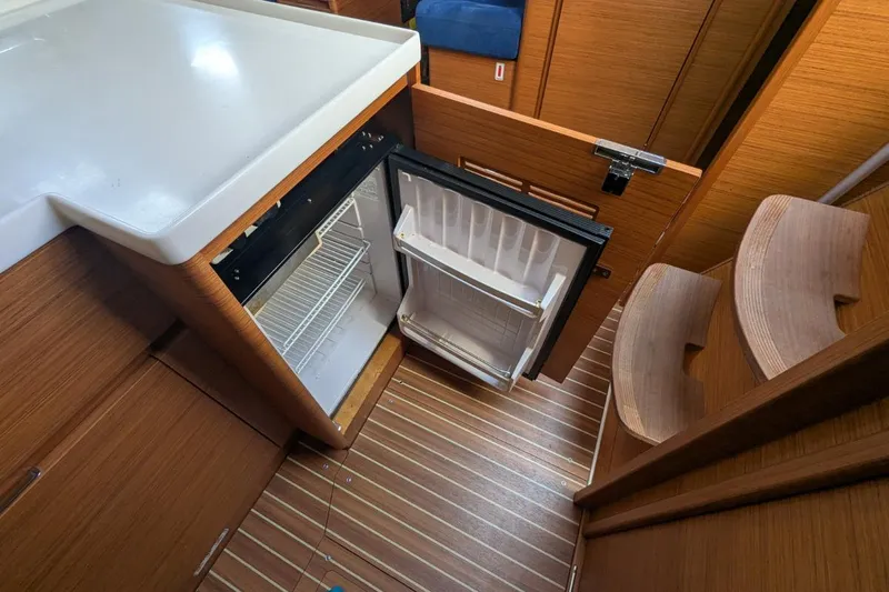 Muchacha De Abril Yacht Photos Pics 2017 X-Yachts Xc 45 yacht interior with open fridge and wooden flooring.
