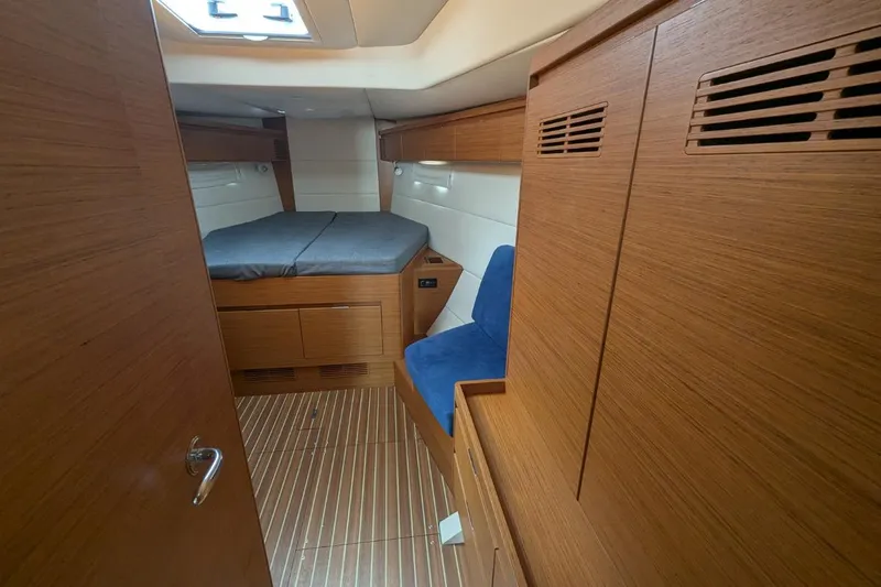 Muchacha De Abril Yacht Photos Pics Interior of 2017 X-Yachts Xc 45, featuring wooden cabinetry and a cozy sleeping area.