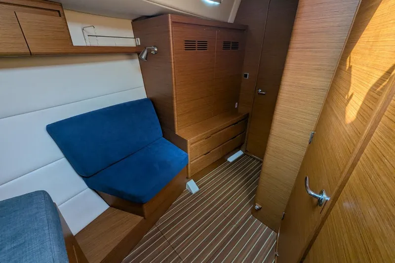 Muchacha De Abril Yacht Photos Pics Interior of 2017 X-Yachts Xc 45, featuring wooden cabinetry and blue seating.