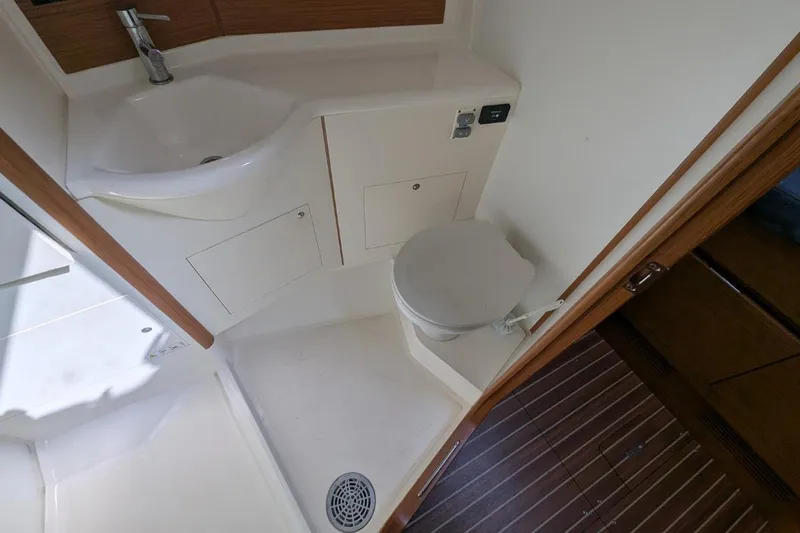 Muchacha De Abril Yacht Photos Pics Bathroom interior of 2017 X-Yachts Xc 45 sailboat, featuring sink and toilet.