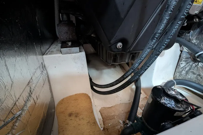 Muchacha De Abril Yacht Photos Pics Engine compartment of 2017 X-Yachts Xc 45 sailboat, showing hoses and components.