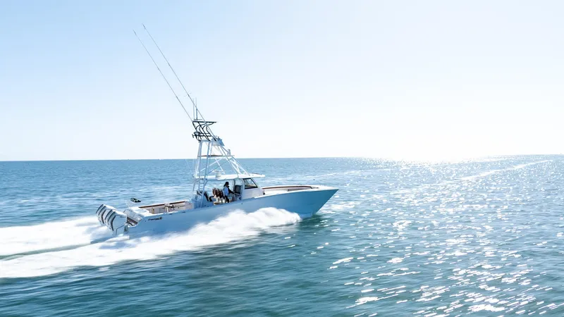  Yacht Photos Pics 2022 Freeman 47 boat speeding on open water.