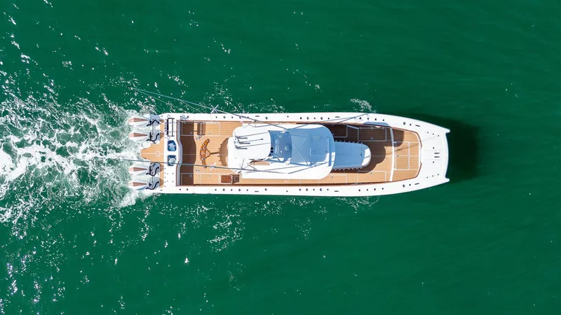  Yacht Photos Pics Aerial view of 2022 Freeman 47 yacht cruising on green water.